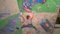 CLOSE UP: Unrecognizable nimble woman climbs up an indoor bouldering route. Royalty Free Stock Photo