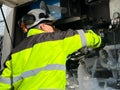 Close-up of an unrecognizable nitrogen tank filling technician preparing the truck and stopcocks for refueling liquid nitrogen at