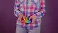 Close up of unrecognizable person playing with pop it. Unknown nervous woman plays with anti-stress toy and throws it.