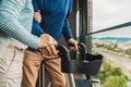 Unrecognizable caucasian senior couple holding hands outside on the balcony Royalty Free Stock Photo