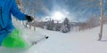 CLOSE UP: Unrecognizable skier sprays champagne powder while skiing off-piste. Royalty Free Stock Photo