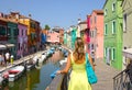 CLOSE UP: Unrecognizable woman looking at the picturesque streets of Venice.