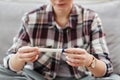 Close up of unrecognizable young woman holding pregnancy test waiting for result Royalty Free Stock Photo