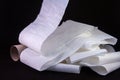 close up of an unrolling of toilet paper with the empty card at the side Royalty Free Stock Photo