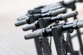 Close-up of upper part of electric scooters in the city. Modern alternative transport concept Royalty Free Stock Photo