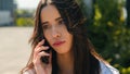 Close-up upset frustrated arabian woman talking on mobile phone outdoors receive bad news worried stressed girl student Royalty Free Stock Photo