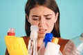 Close up upset girl sadly looking on plastic waste over colorful background isolated