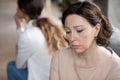 Close up upset mature mother and grownup daughter after quarrel