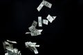 Close up of us dollar money flying over black Royalty Free Stock Photo