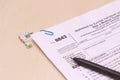 Close up of USA tax form type 8843, statement for exempt individuals and individuals with a medical condition and black pen