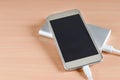 Close-up of usb  fast charge power bank charging a smartphone .External  battery  for recharging  portable devices Royalty Free Stock Photo