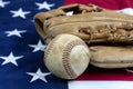 Close up of a used baseball and mitt on United States flag Royalty Free Stock Photo
