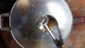 Close up used oil on iron flying pan,Oily staine after cooking. Royalty Free Stock Photo