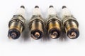 Close up of used spark plugs with focus on the electrode with deposits Royalty Free Stock Photo