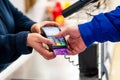 Close up of using credit card pos terminal to pay. Hands entering the password of creditcard for payment. Royalty Free Stock Photo