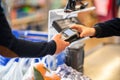 Close up of using credit card pos terminal to pay. Hands entering the password of creditcard for payment. Royalty Free Stock Photo