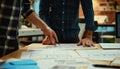 Close up ux developer and ui designer brainstorming interface wireframe design.