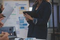 Close up ux developer and ui designer use augmented reality brainstorming about mobile app interface wireframe design on desk at Royalty Free Stock Photo