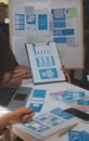 Close up ux developer and ui designer use augmented reality brainstorming about mobile app interface wireframe design on desk at Royalty Free Stock Photo