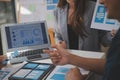 Close up ux developer and ui designer use augmented reality brainstorming about mobile app interface wireframe design on desk at Royalty Free Stock Photo