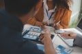 Close up ux developer and ui designer use augmented reality brainstorming about mobile app interface wireframe design on desk at Royalty Free Stock Photo
