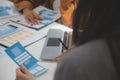 Close up ux developer and ui designer use augmented reality brainstorming about mobile app interface wireframe design on desk at Royalty Free Stock Photo