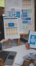 Close up ux developer and ui designer use augmented reality brainstorming about mobile app interface wireframe design on desk at Royalty Free Stock Photo