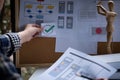 A close-up of an ux ui developer and an ui designer working on a mockup icon interface for a mobile app. Royalty Free Stock Photo