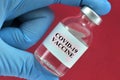 Covid-19 vaccine vial concept on red background