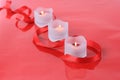 Close-up of valentine candles with ribbon