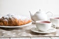 Close up. Valentine`s day celebration. Romantic breakfast for two. French croissants and berry tea in vintage porcelain cups. Cop Royalty Free Stock Photo