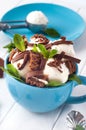 Close up of vanilla ice cream balls covered with chocolate biscuits in the cup Royalty Free Stock Photo