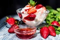 Strawberry ice cream with mint in bowl and jam Royalty Free Stock Photo