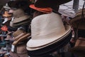 Close up of variety of hats for sale at market