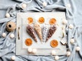 Nuts balls in stylish, transparent glass bowl with chilly pepper, on the white surface. Close up taken. Luxury tasty Royalty Free Stock Photo