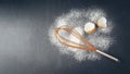 Close up of various baking utensils for baking cookies and cakes like rolling pin whisk and baking pan on dark background Royalty Free Stock Photo