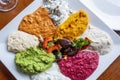 Close-up of various colorful Middle Eastern dips and spreads