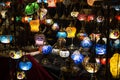 Close-up of various colorful round shaped retro glass lamps in darkness, in the market, as vintage color effect Royalty Free Stock Photo