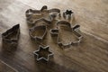 Various cookie cutters on wooden table Royalty Free Stock Photo