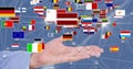 Close-up of various flags over hand Royalty Free Stock Photo