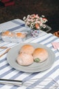 Close up various fresh baked buns/bread in market  with sweetened condensed milk, Thai tea custard on plate Royalty Free Stock Photo