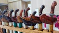 Close up of various keris or traditional indonesian weapon handles and scabbards with unique wood carvings Royalty Free Stock Photo