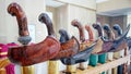 Close up of various keris or traditional indonesian weapon handles and scabbards with unique wood carvings Royalty Free Stock Photo