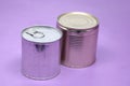 Close up various metal and white tin can on purple background