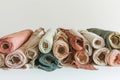 Close-up of various rolls of multicolored fabric stacked Royalty Free Stock Photo