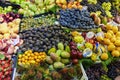 Close-up of various seasonal fruits displayed at a market stall in Porto