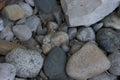 Close up of various sized washed gravel and a limestone block