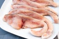 Close-up of various slices of raw swordfish, in a white plate, on a slate table..Tasty food from Italian cuisine and from the Royalty Free Stock Photo