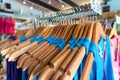 Close-up of blue t-shirts hanging on cloth hanger Royalty Free Stock Photo