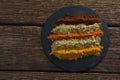 Various type of spice powder on a chopping board